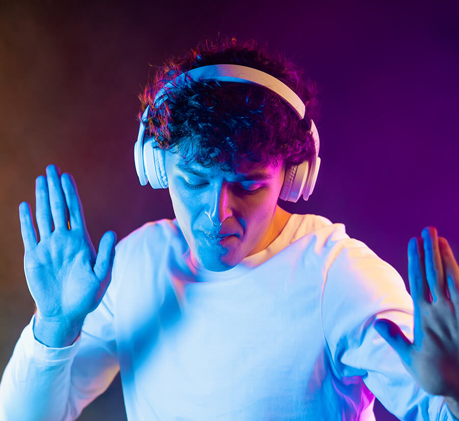 positive-man-listening-music-with-headphones